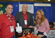 Brett Reasor, Scott Marboe and Ellie Tucker with Starr Ranch exhibit at the New York Produce Show for the first time. The company is happy about the positive feedback it receives on the Juici apple.
